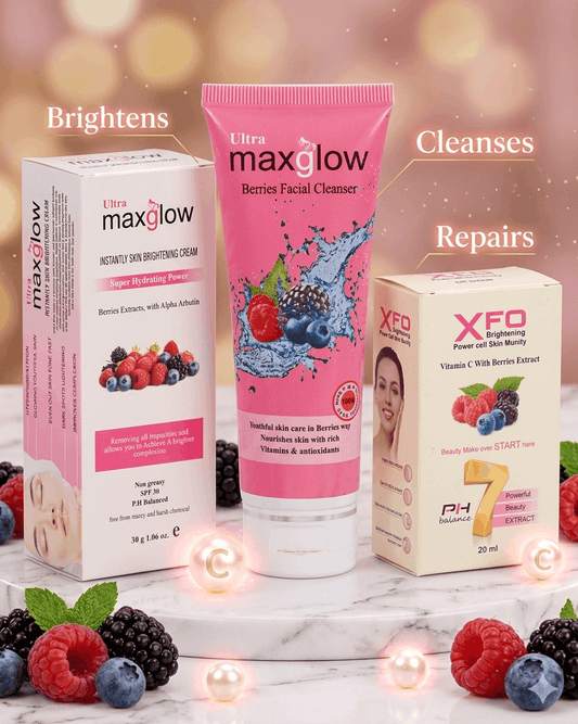 Ultra Maxglow 3-piece brightening skincare bundle — Berries Facial Cleanser tube, Instantly Skin Brightening Cream box, and XFO Brightening Power Cell Serum box arranged on marble surrounded by fresh raspberries, blueberries and blackberries with glowing benefit callouts.
