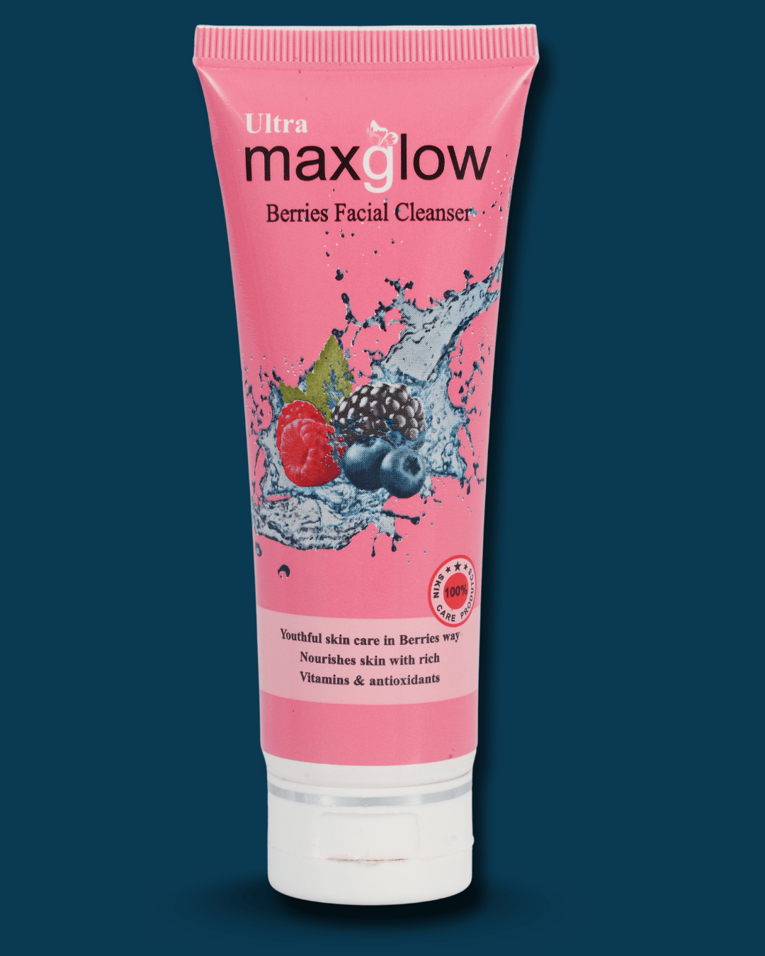 Pink facial cleanser tube with berries on a dark blue background